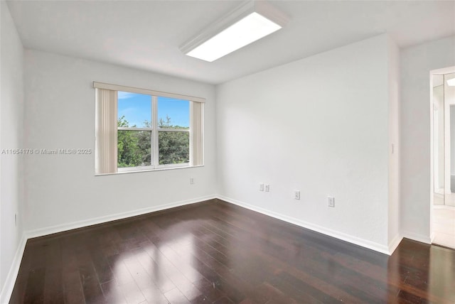 15421 SW 18th St, Miramar, FL 33027 - spare room with dark wood-type flooring and baseboards