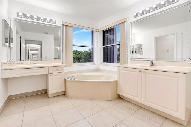 full bath featuring tile patterned flooring, vanity, and a garden tub