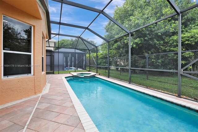 view of swimming pool with a patio, glass enclosure, and an in ground hot tub