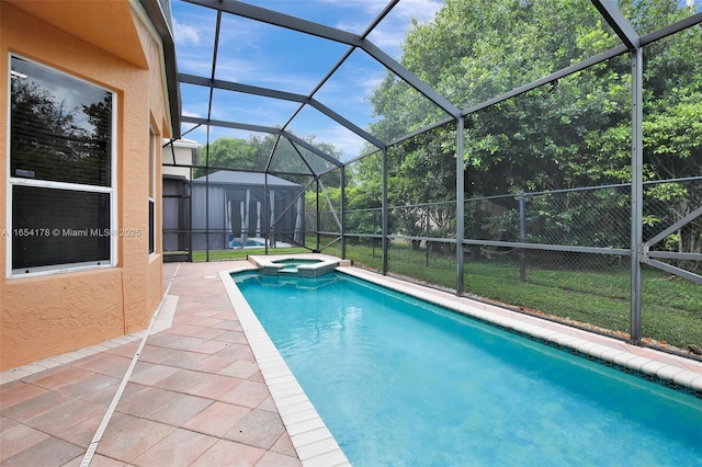 view of pool featuring a lanai, a patio, an outbuilding, and a pool with connected hot tub