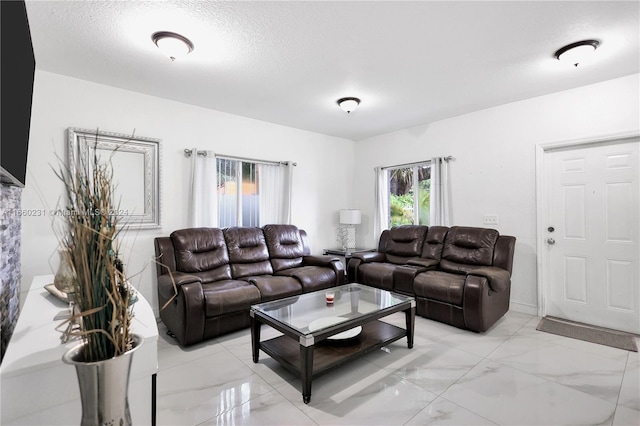 living room with a textured ceiling