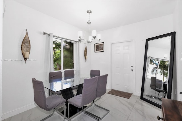 dining space with a chandelier