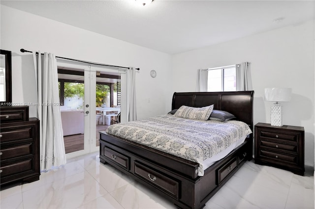 bedroom featuring access to outside, french doors, and multiple windows