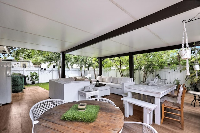 view of patio with outdoor lounge area and a wooden deck