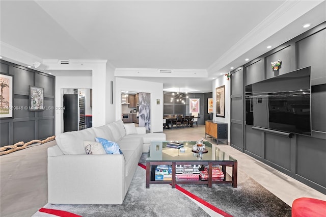 living room with ornamental molding