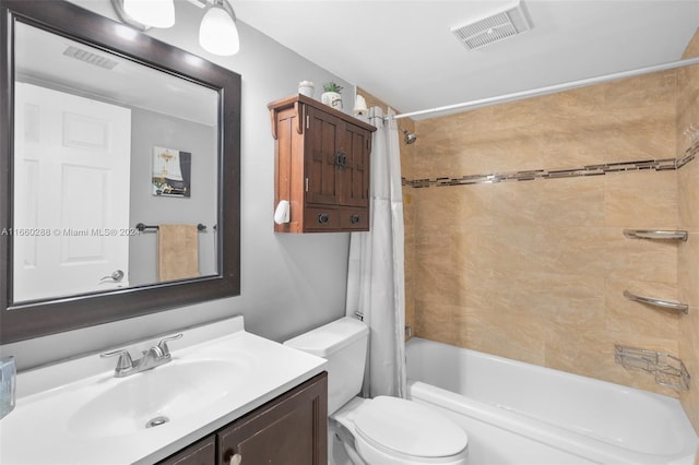 full bathroom with shower / bath combo with shower curtain, vanity, and toilet