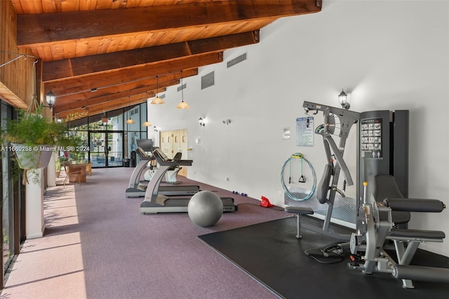 workout area featuring wood ceiling, light carpet, and high vaulted ceiling