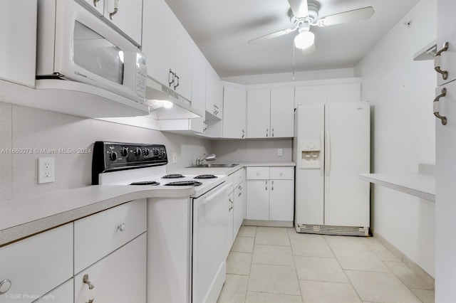 kitchen featuring white appliances, light tile patterned floors, sink, white cabinetry, and ceiling fan