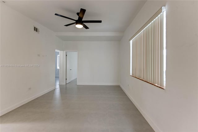 unfurnished room featuring ceiling fan