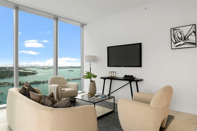 living room with expansive windows and light tile patterned flooring