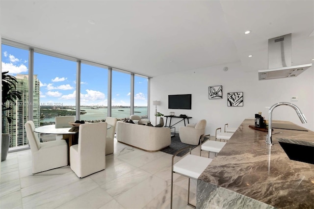 dining area with sink and expansive windows