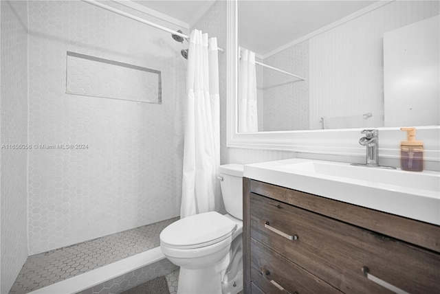 bathroom featuring crown molding, vanity, a shower with shower curtain, and toilet