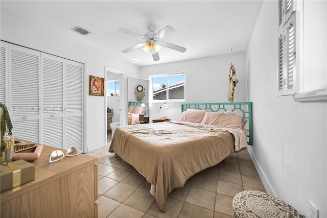 bedroom featuring light tile patterned floors, a closet, and ceiling fan