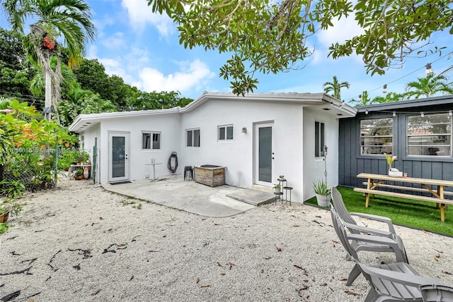 rear view of property featuring a patio