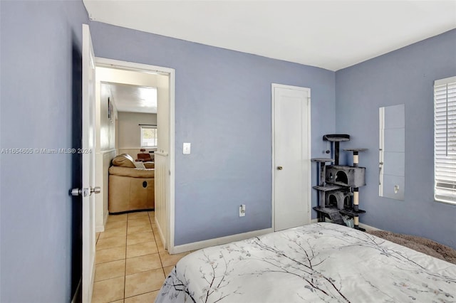 380 E 45th St, Hialeah, FL 33013 - bedroom featuring light tile patterned floors and baseboards