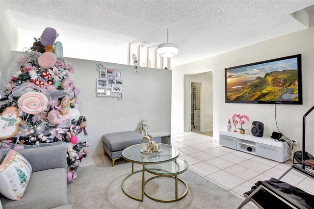 380 E 45th St, Hialeah, FL 33013 - living area featuring light tile patterned floors and a textured ceiling
