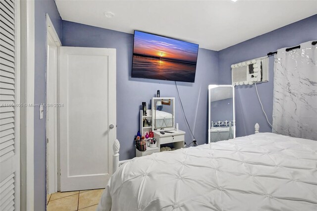 380 E 45th St, Hialeah, FL 33013 - tiled bedroom featuring a wall unit AC