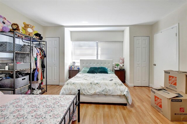 380 E 45th St, Hialeah, FL 33013 - bedroom with light wood-type flooring and two closets