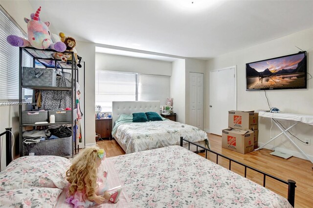 380 E 45th St, Hialeah, FL 33013 - bedroom with wood finished floors and baseboards