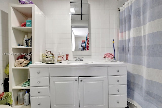 380 E 45th St, Hialeah, FL 33013 - full bathroom with vanity, tile walls, and a shower with curtain