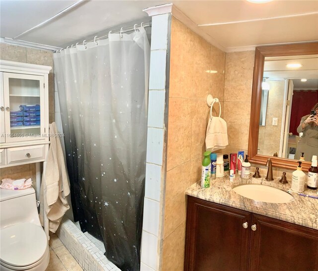 380 E 45th St, Hialeah, FL 33013 - full bathroom with tile walls, a stall shower, tile patterned floors, and vanity