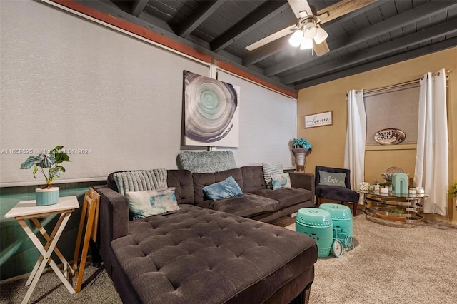 sitting room with wood ceiling, carpet, ceiling fan, and beam ceiling