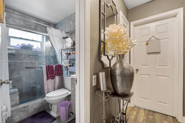 bathroom featuring a shower with curtain, wood-type flooring, and toilet