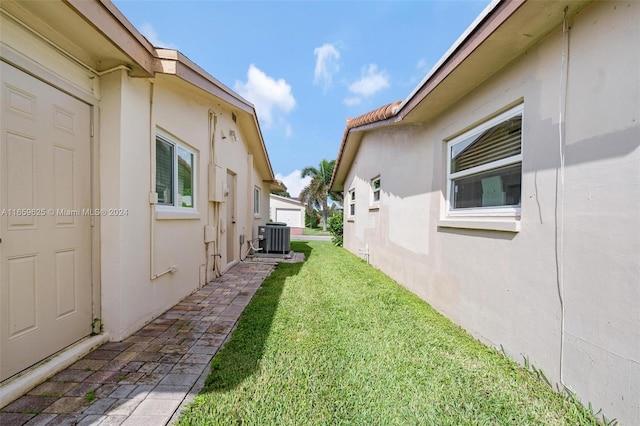 view of yard with central AC