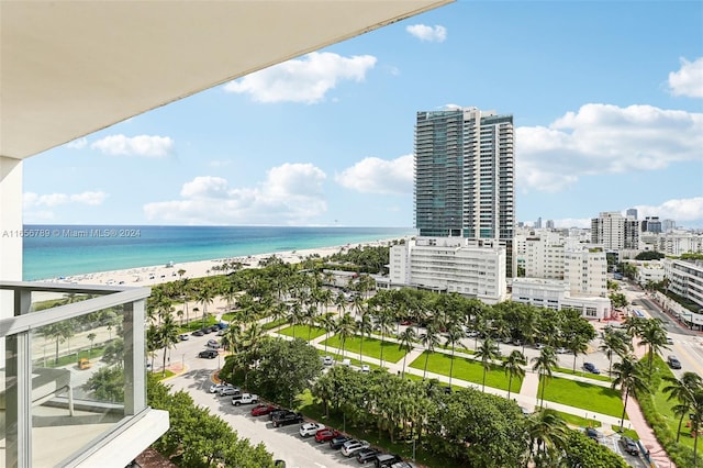 exterior space with a water view and a beach view