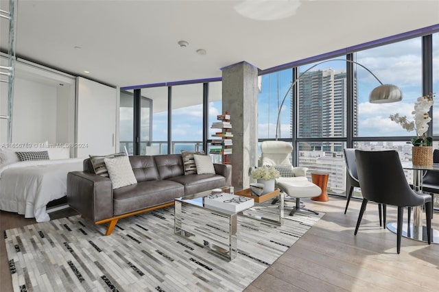 living room with light hardwood / wood-style flooring and expansive windows