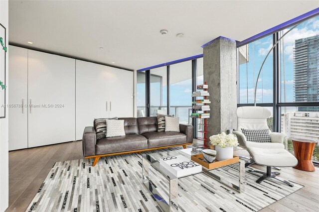 2201 Collins Ave Unit 1201, Miami Beach, FL 33139 - living room featuring hardwood / wood-style floors, expansive windows, and plenty of natural light