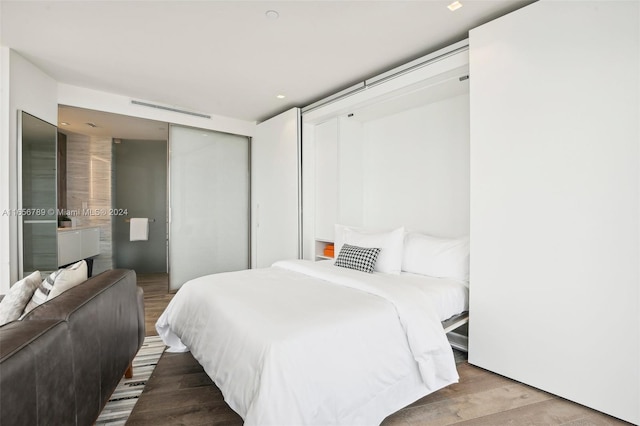 bedroom with light hardwood / wood-style floors