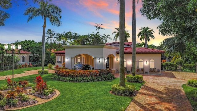 6710 SW 92nd St, Pinecrest, FL 33156 - mediterranean / spanish-style house featuring a yard, stucco siding, and a tile roof