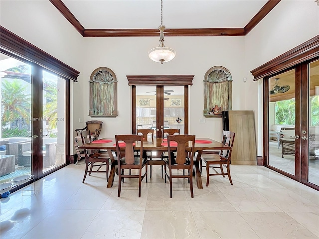 dining room featuring crown molding and french doors