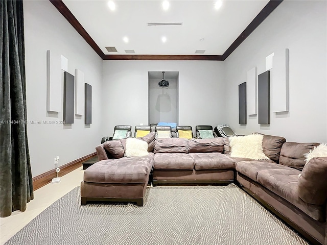 home theater room with ornamental molding