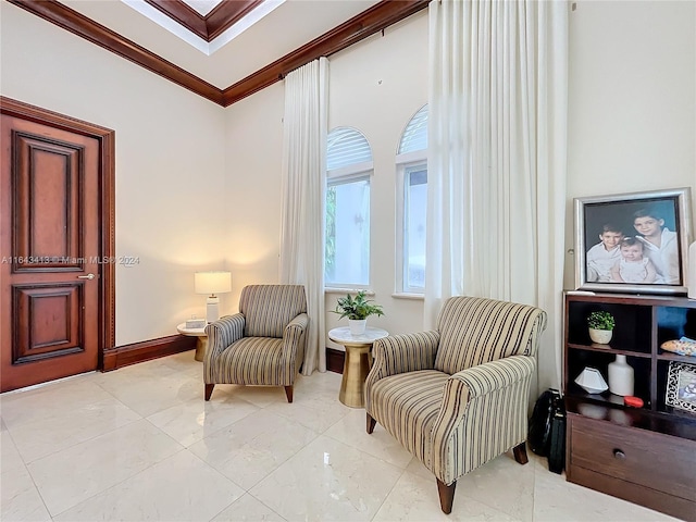 sitting room with crown molding