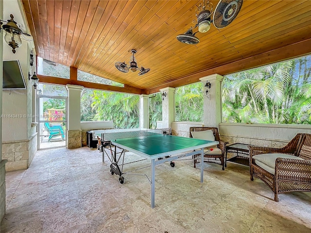 recreation room with vaulted ceiling and wooden ceiling