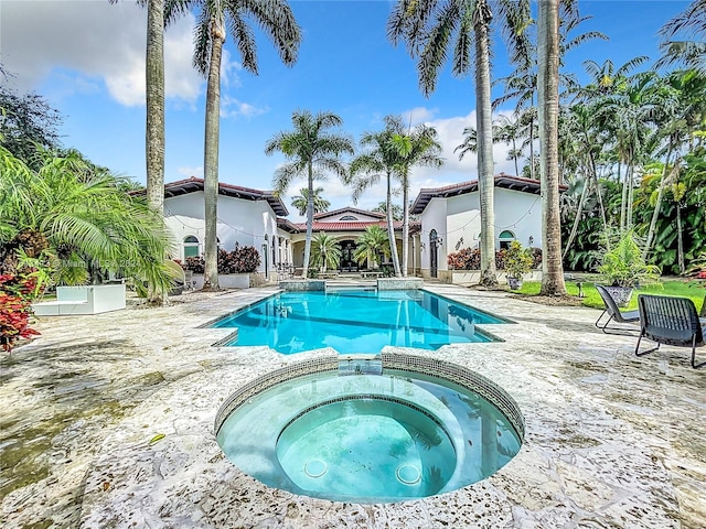6710 SW 92nd St, Pinecrest, FL 33156 - view of pool featuring a pool with connected hot tub and a patio