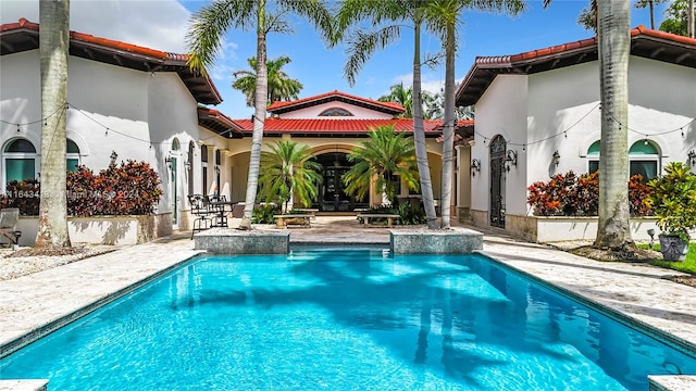 view of pool featuring a patio area