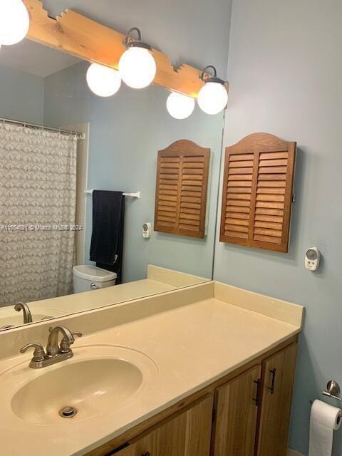 bathroom with vanity and toilet