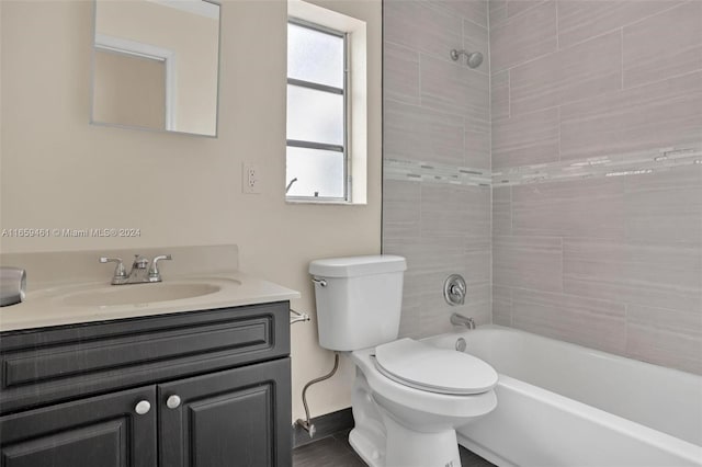 full bath with toilet, shower / bathtub combination, and vanity