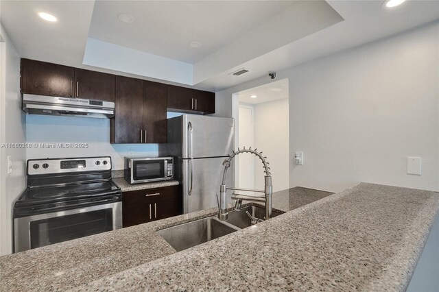 full bathroom with vanity, toilet, shower / bath combo with shower curtain, and backsplash