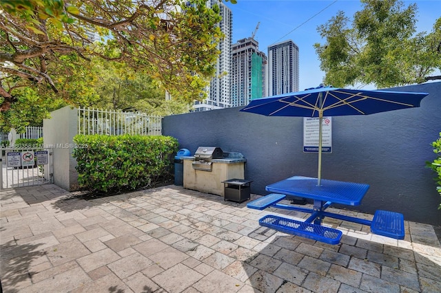 850 N Miami Ave Unit W-1810, Miami, FL 33136 - view of patio with fence, a grill, and area for grilling