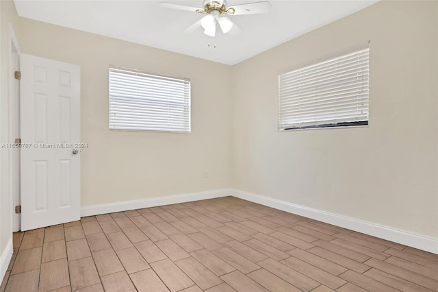 spare room with ceiling fan and light hardwood / wood-style floors