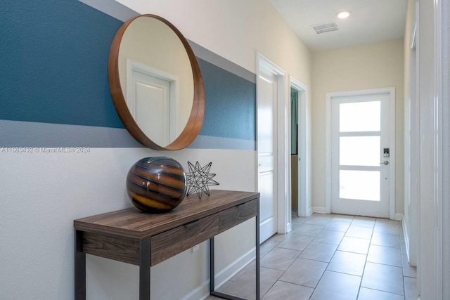 doorway to outside featuring light tile patterned floors