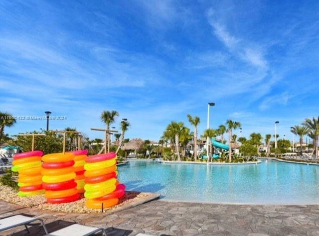 view of pool featuring a water slide