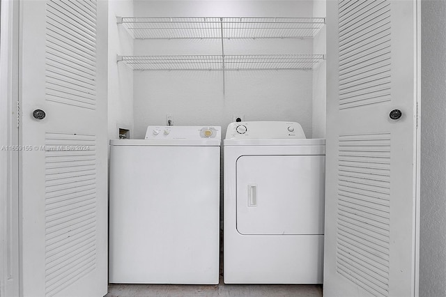 clothes washing area featuring washing machine and clothes dryer