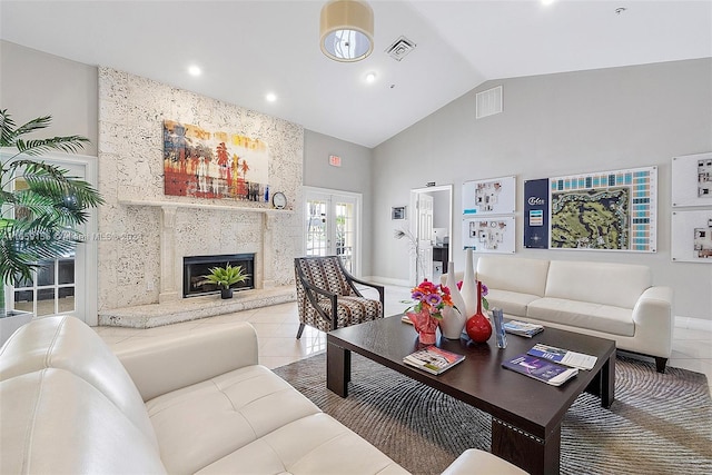 living room featuring a premium fireplace, french doors, high vaulted ceiling, and tile patterned flooring