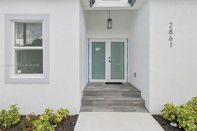 doorway to property featuring french doors