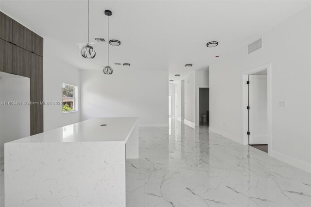 kitchen with a center island and pendant lighting